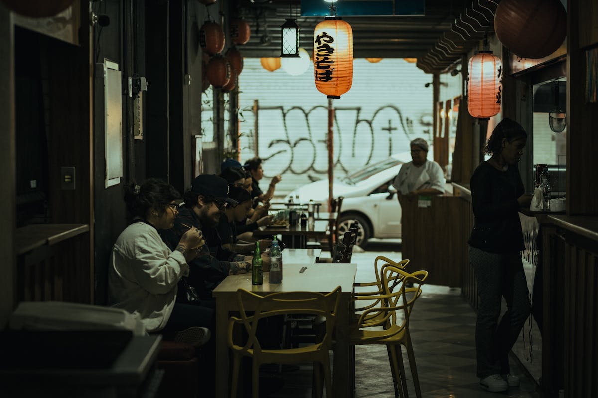 Warm restaurant interior with diners