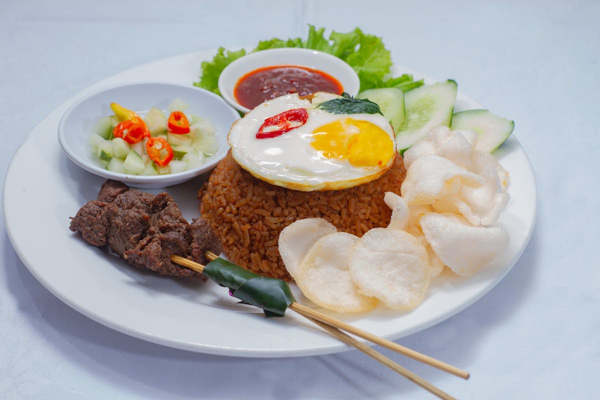 Nasi goreng with egg and crackers